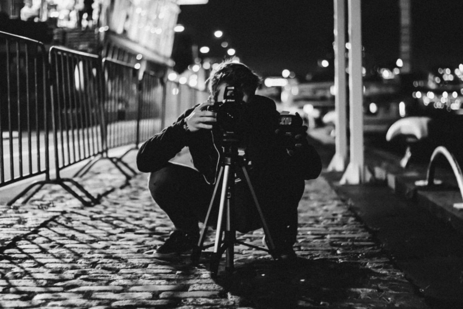 Photographer reviewing contact sheets during mentorship session